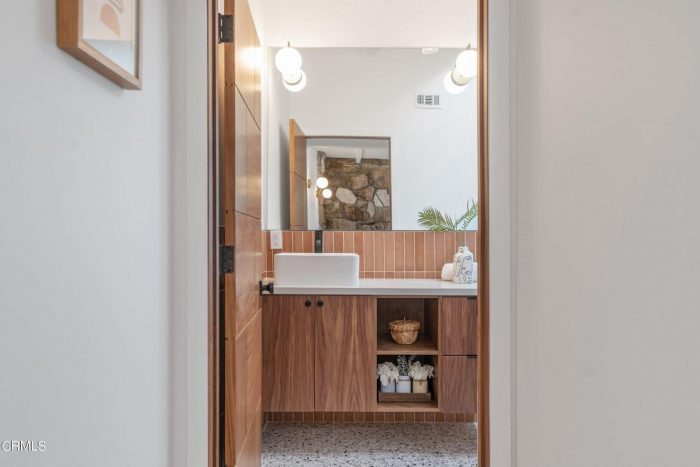 Bathroom with wood panel cabinets