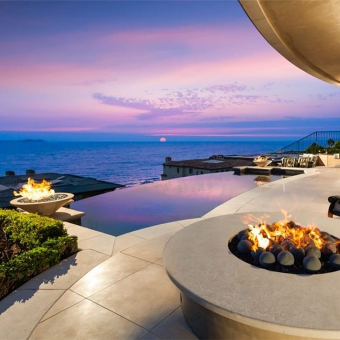 Deck with fire pits, pool and ocean view at The Strand at Headlands in Dana Point