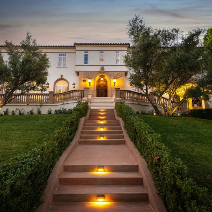 Lit up stairs leading to 30,000 square foot estate