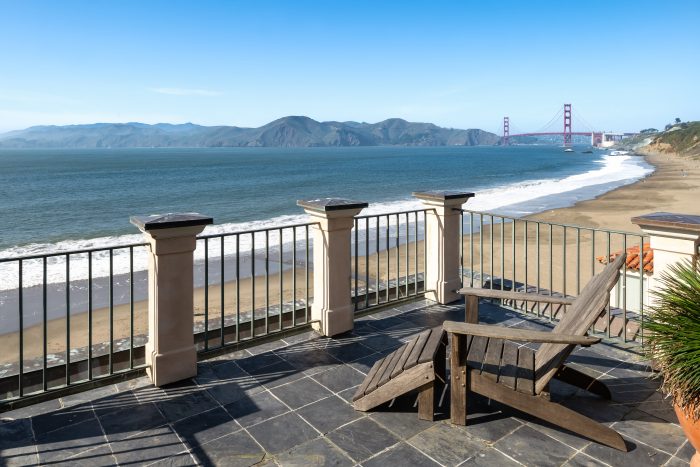Patio with lounge chair view of Golden Gate Bridge, Pacific ocean and beach front