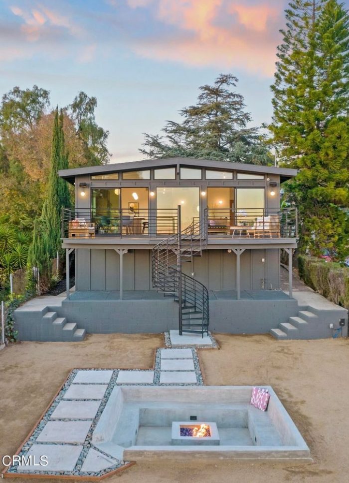 Spiral staircase leads to back deck of house