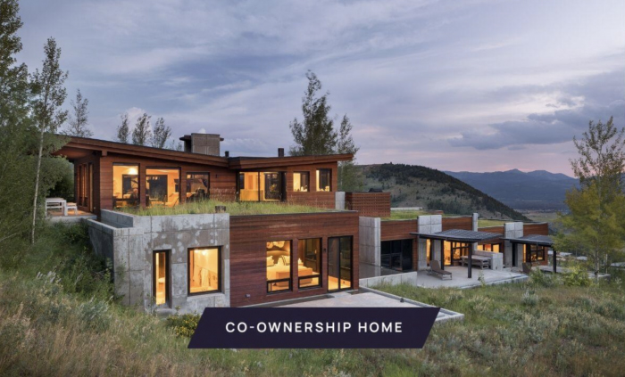 House at dusk with interior lights on