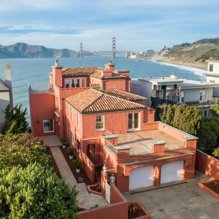 Aerial view of house with adobe tiles and view of Golden Gate Bridge