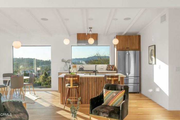 kitchen with walnut cabinetry and a slatted islan