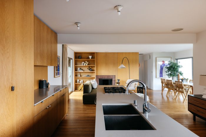 Kitchen with  white oak floor-to-ceiling built-ins and inset sink