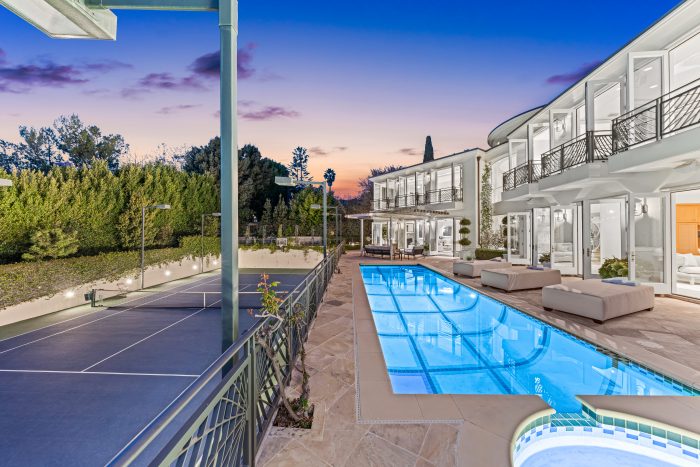 Backyard with pool and Tennis court.