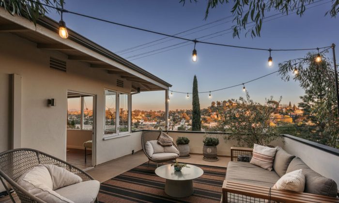 Mid-century modern house patio at sunset overlooking downtown LA