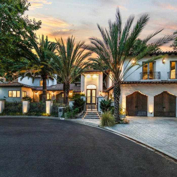 Mediterranean villa estate with palm trees