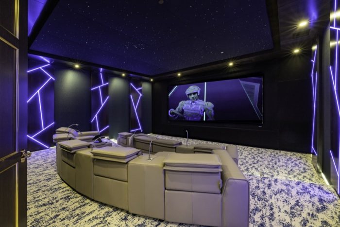 The movie room with giant screen. 