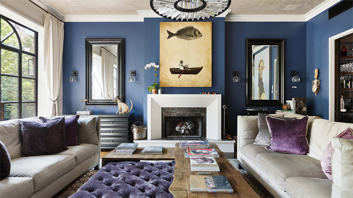 Livingroom in modernized 1870 upper east side townhouse with blue walls and decor