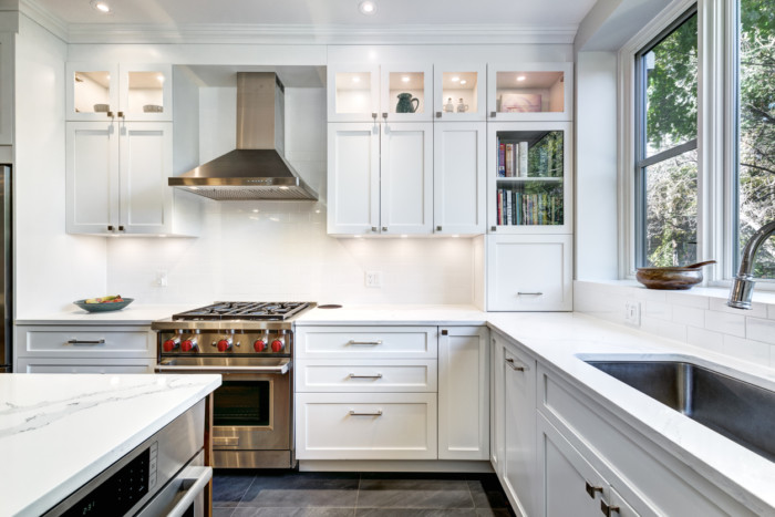 A modern white kitchen with luxury finishes.