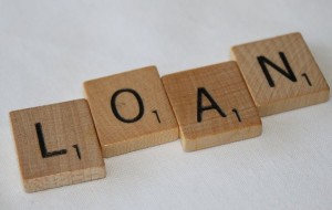 Scrabble letters spelling the word "loan"