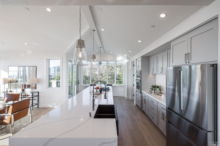 Modern white kitchen with Glass pendant hanging lighting