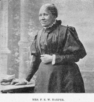 Image of Frances Harper shown standing near a desk