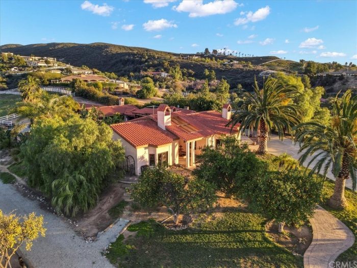 Spanish villa in Temecula with 2 large palm trees