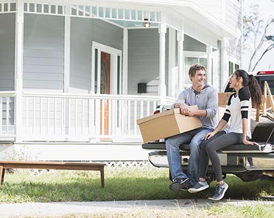 Young couple in moving truck